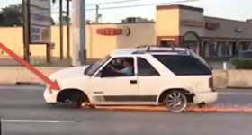 Insane Driver Plows Down Highway Without Rims 4