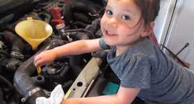 Little Girl Mechanic Changes Oil 2